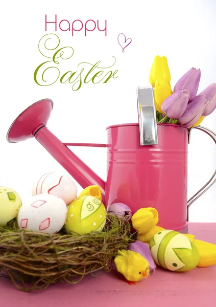 Happy Easter watering can, flowers and easter eggs. — Stock Photo, Image