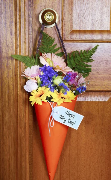 Happy May Day gift of flowers on door. — Stock Photo, Image