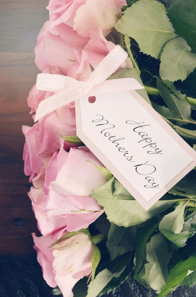 Mothers Day pink roses on rustic dark wood table. — Stock Photo, Image