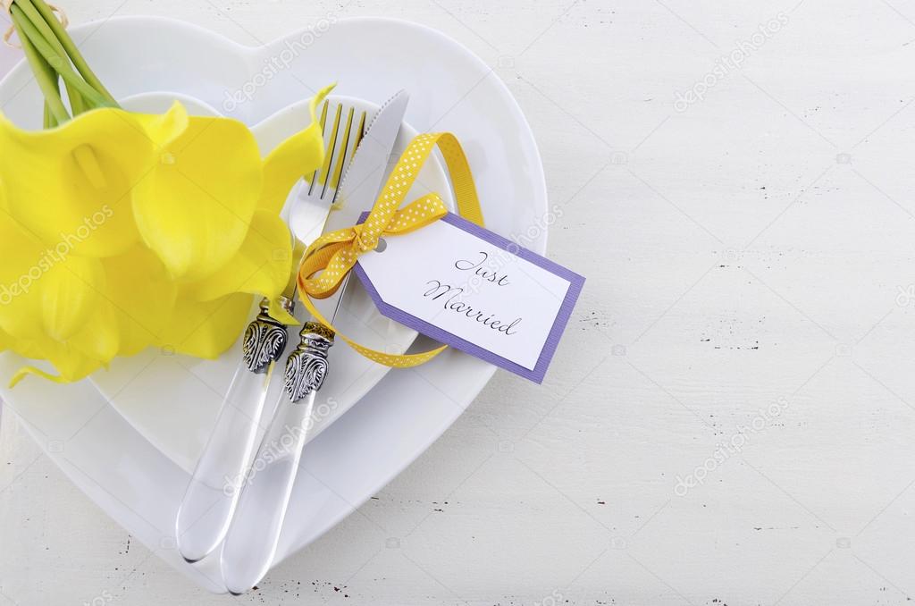 Yellow and white theme wedding table place setting. 