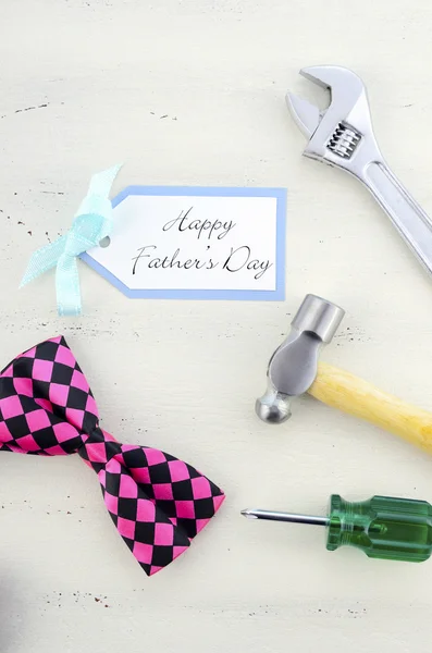 Happy Fathers Day concept with mens tools and pink bow tie. — Stock Photo, Image
