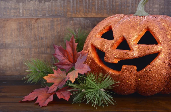 Happy Halloween table with Jack O Lantern pumpkin — Stockfoto