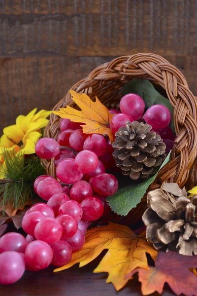 Thanksgiving cornucopia on wood background. — Stock Fotó