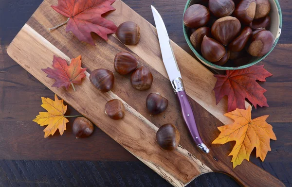 Chestnuts on Rustic Wood Table — Stockfoto