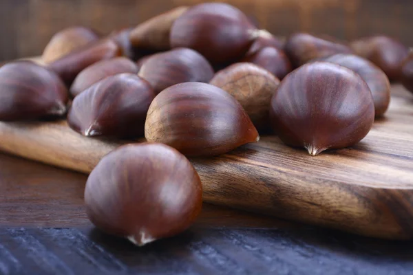 Chestnuts on Rustic Wood Table — 스톡 사진