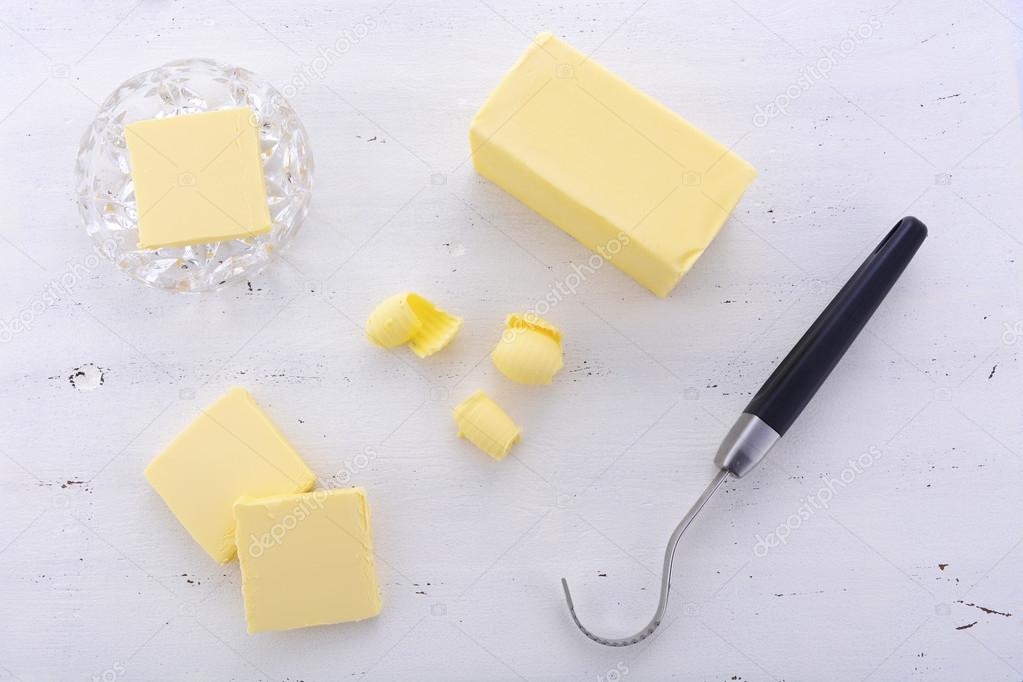 Butter on white wood table.