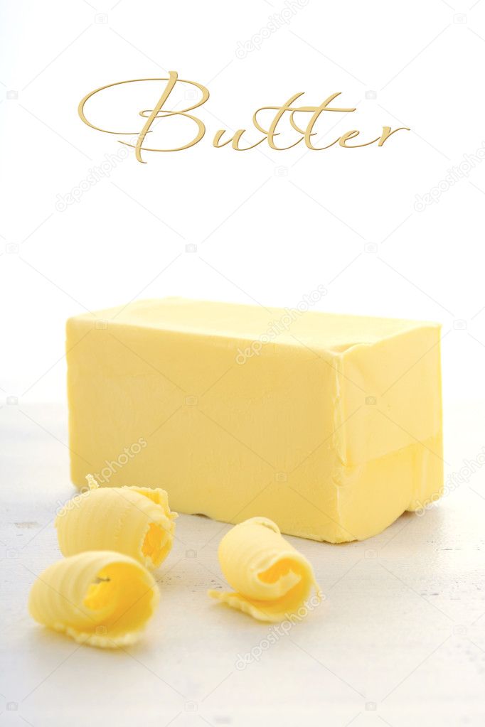 Butter on white wood table.