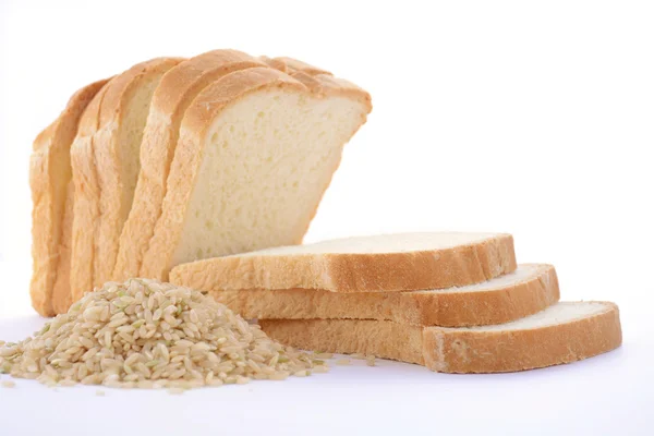 Loaf Rice Sourdough bread with raw brown rice. — Stock Photo, Image