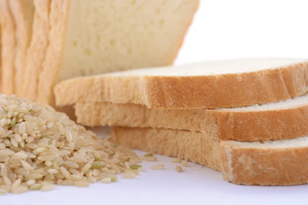 Loaf Rice Sourdough bread with raw brown rice. — Stock Photo, Image