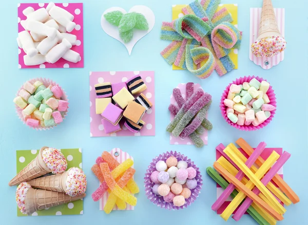 Bright Colorful Candy on Pale Bluw Wood Table. — 图库照片