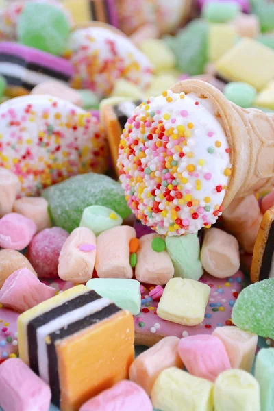 Bright colorful candy on pale blue wood table. — Φωτογραφία Αρχείου