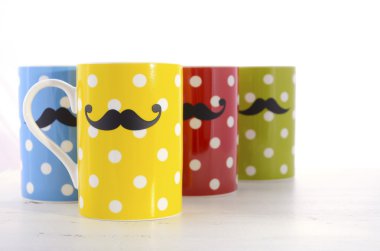 Colorful coffee mugs with mustaches.