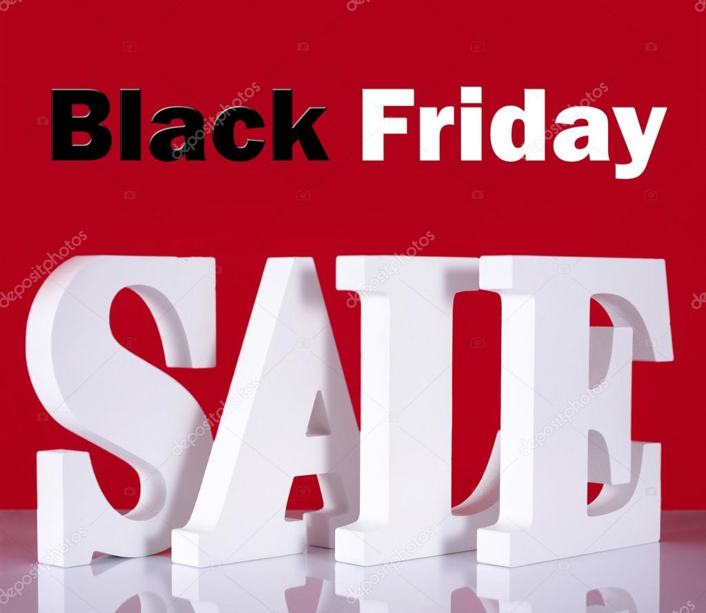 Black Friday Wooden Sale Letters on Red Background.