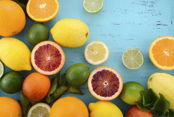 Citrus Fruit on blue wood table. — Stock Photo, Image