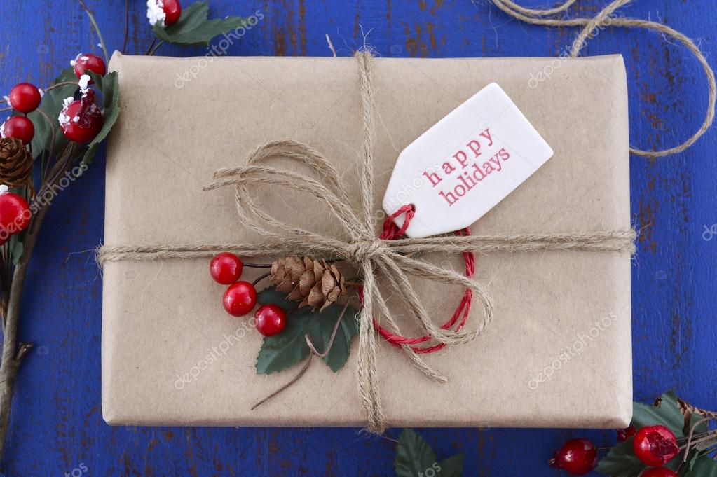 Gift wrapping presents on dark blue table. Stock Photo by ©amarosy 91746514