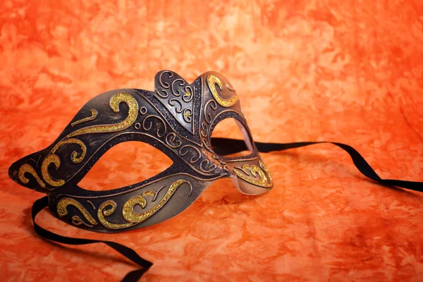 Mardi Gras mask on orange background. — Stock Photo, Image