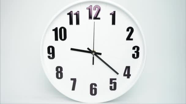 White Clock Black Hands Display Clock Rotates Speed Hours Clock — Video Stock