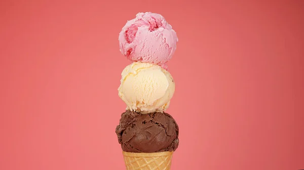 strawberry & Vanilla ice cream on top Chocolate ice cream cone isolated on pink background.