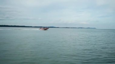 Panorama view Small tourist speed boat in Sea on blue sky background.
