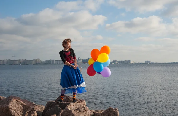 Flicka med ballonger — Stockfoto