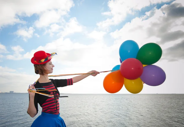 Flicka med ballonger — Stockfoto