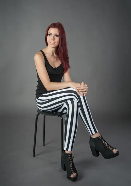 Girl in striped trousers — Stock Photo, Image