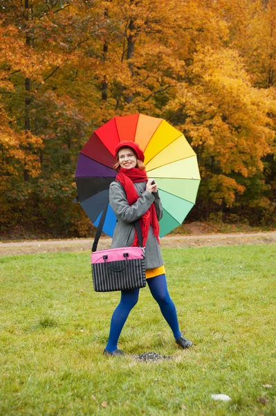 Cheerful woman enjoying autumn day in park — Stock Photo, Image