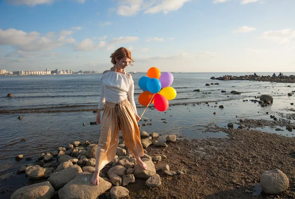 Girl with balloons — Stock Photo, Image