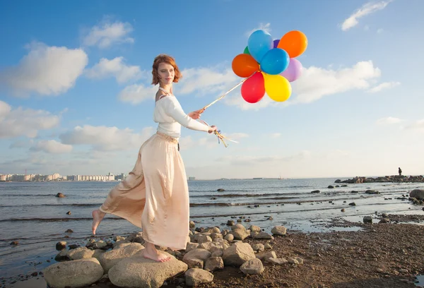 Girl with balloons — Stock Photo, Image