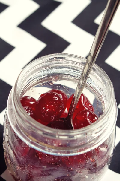 Glace cherries in a vintage jar overhead — Stock Photo, Image