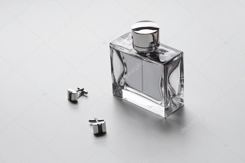 Horizontal mens cologne and cufflinks 