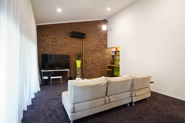 Renovated 70s exposed brick wall apartment living room — Stock Photo, Image