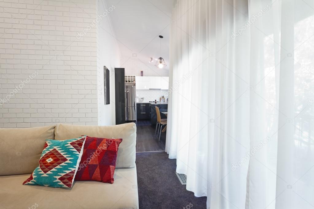 Modern living room sofa and sheer curtains horizontal