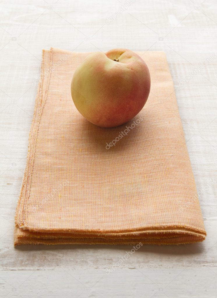 Apricot fruit on a yellow napkin placemat