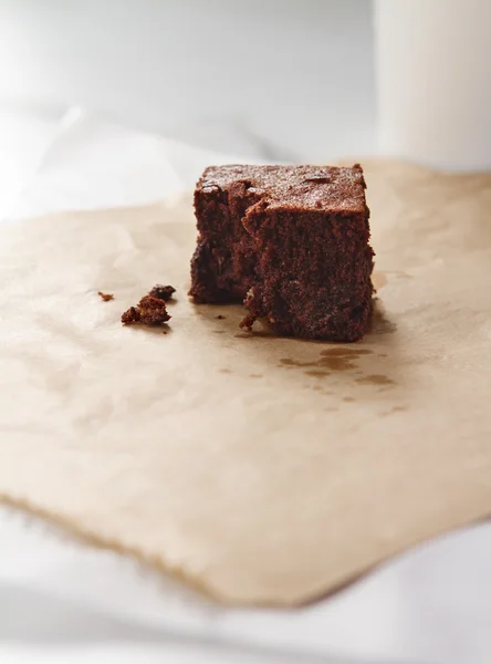 Close up of a delicious chocolate brownie on pale background — Stock Photo, Image