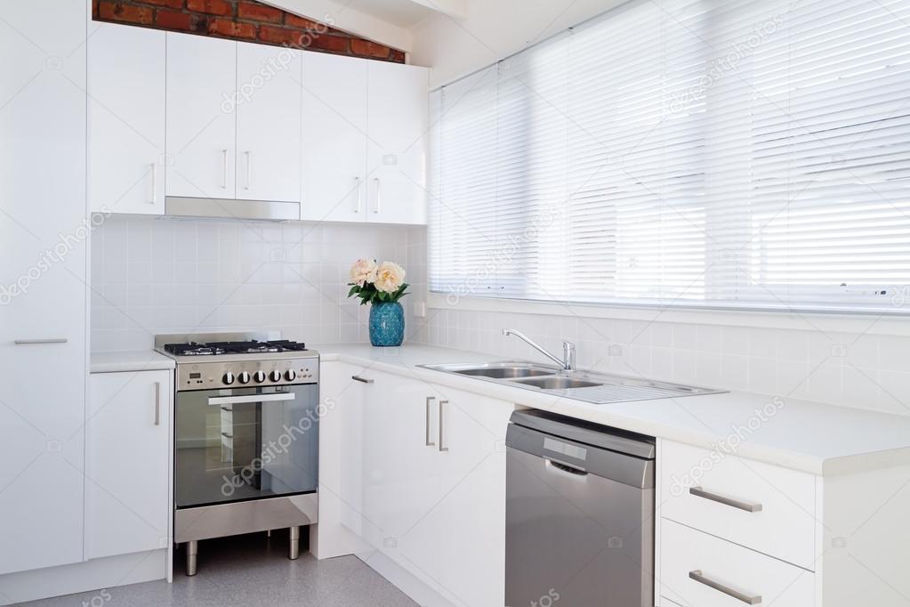 Bright white modern apartment kitchen