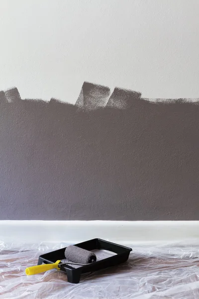Half painted wall with roller and tray with space for text — Stock Photo, Image