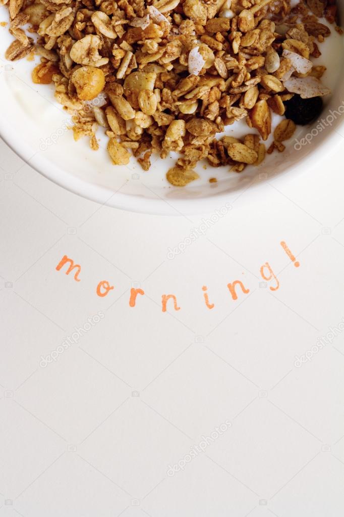 Vertical Morning text stamped under bowl of fresh cereal and milk