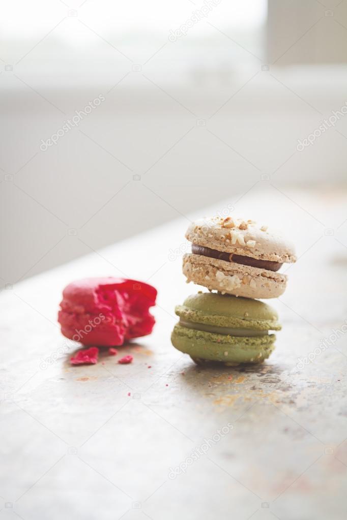 Colorful yummy macaroons in brightly backlit setting with clear