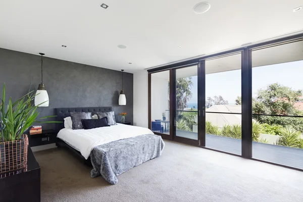 Spacious interior of designer master bedroom in luxury Australia — Stock Photo, Image