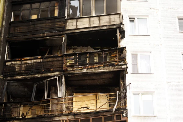 burnt walls of a tall house, moscow