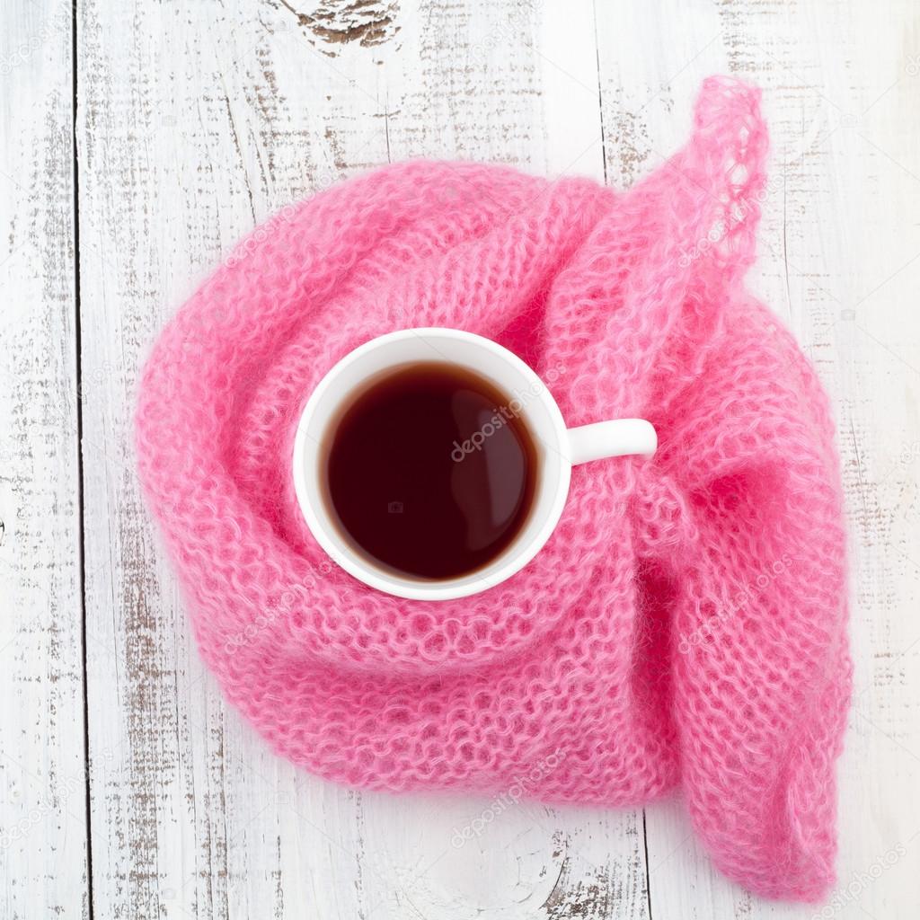 Mug of tea in the knit scarf