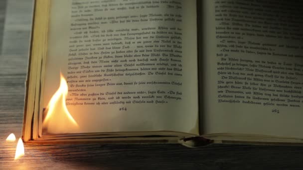 Burning edge of an antique book — Stock Video