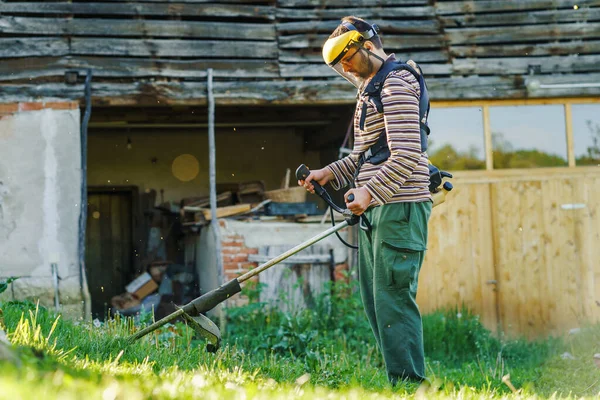 Young Caucasian Man Farmer Gardener Standing Field String Trimmer Petrol — Stock Photo, Image