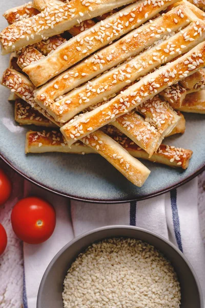 salty sesame bread sticks traditional homemade baked snacks on the table - top view close up healthy vegan or vegetarian food concept with copy space