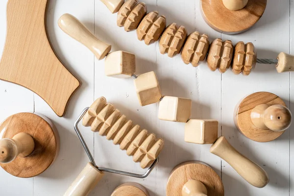 Wood massage maderotherapy madero therapy wooden rolling pin or battledore tools for anti cellulite treatment to stimulate the lymphatic system and improve circulation concept