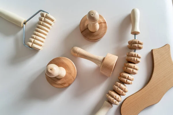 Wood massage maderotherapy madero therapy wooden rolling pin or battledore tools for anti cellulite treatment to stimulate the lymphatic system and improve circulation concept