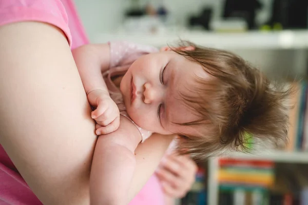 Close Small Caucasian Baby Sleeping Hands Her Mother Home Bright — Stock Photo, Image