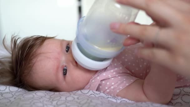 Side View Small Caucasian Baby Four Months Old Drinking Milk — Stock Video