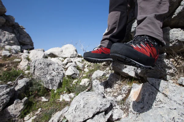 Hiker standing on top of the mountain with valley on the background. — Stock Photo, Image